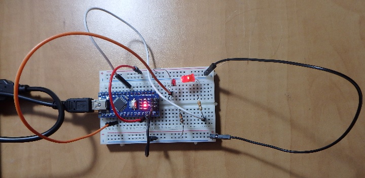 A circuit board with wires Description automatically generated